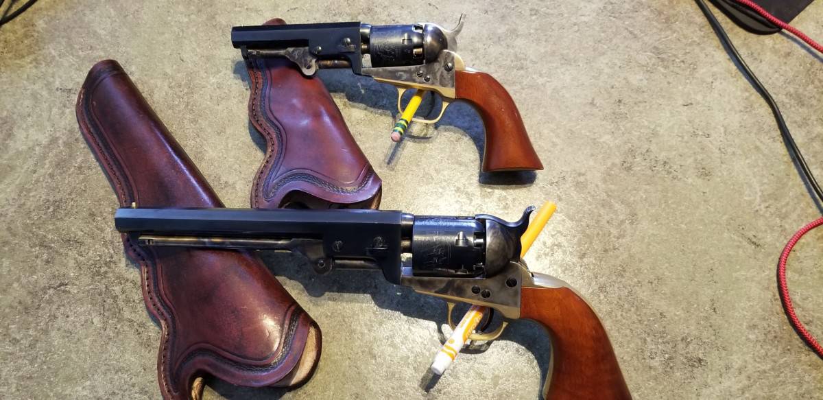 image showing two black powder revolvers
