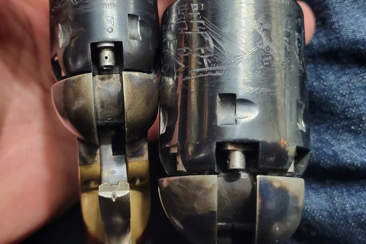 image showing two percussion revolvers with perfect cylinder timing after being fixed.